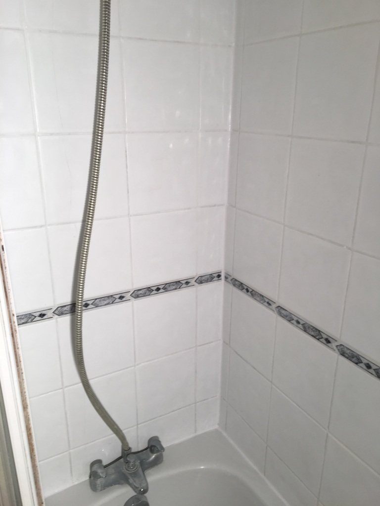 Dirty Ceramic Bath Tiles in Chessington after cleaning