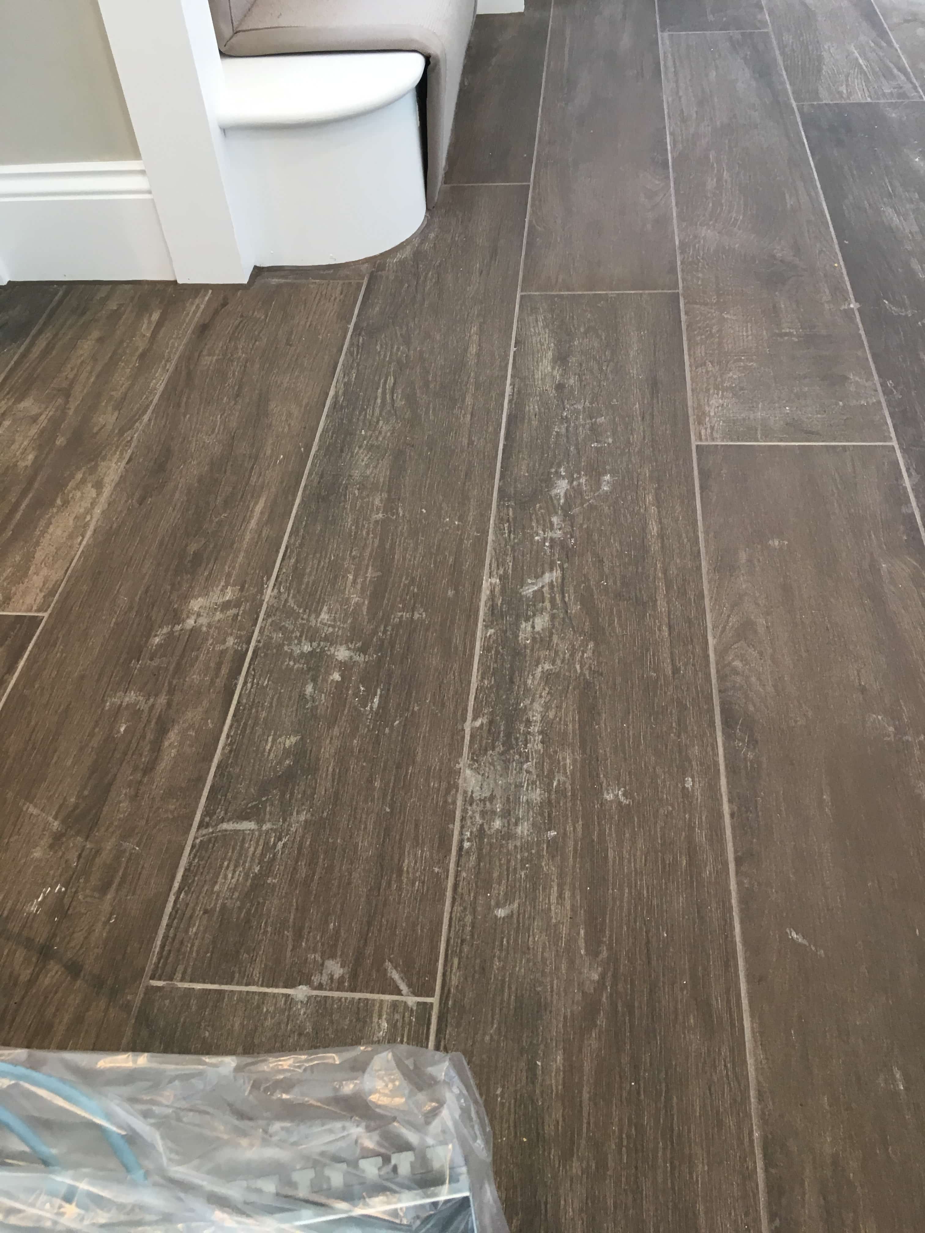 Grout Haze on Wood Effect Ceramic Tiles Before Removal Guildford