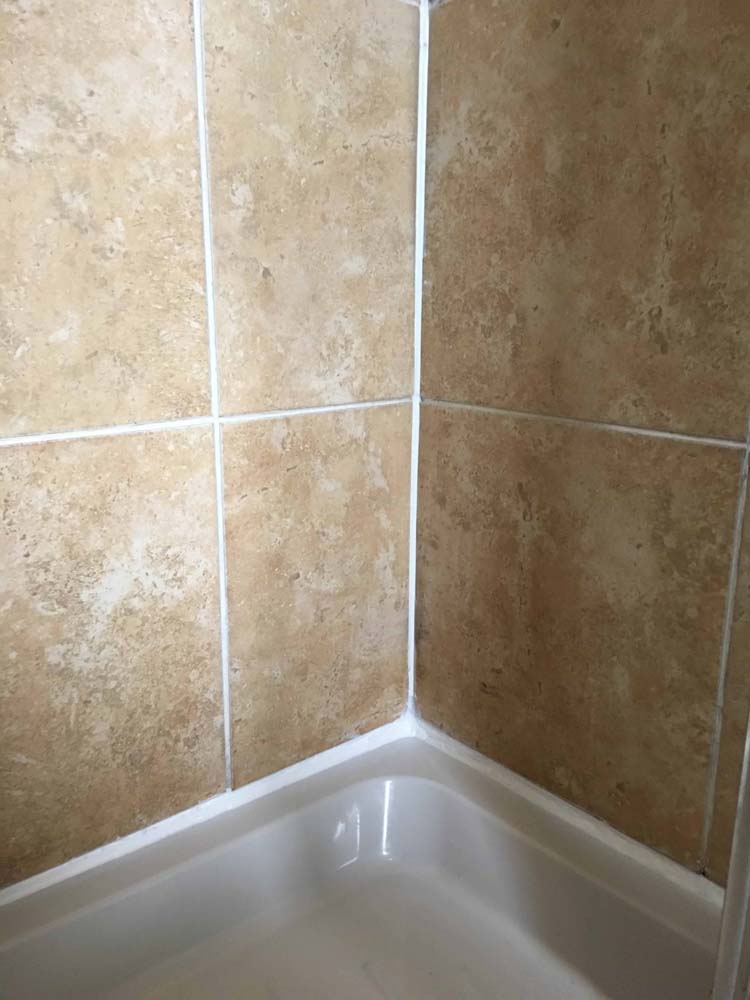 Travertine Shower Cubicle Tiles After Refurbishment Oxshott