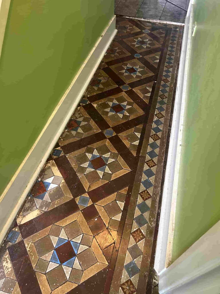 Wax Covered Victorian Tiled Hallway Floor Before Cleaning Addlestone